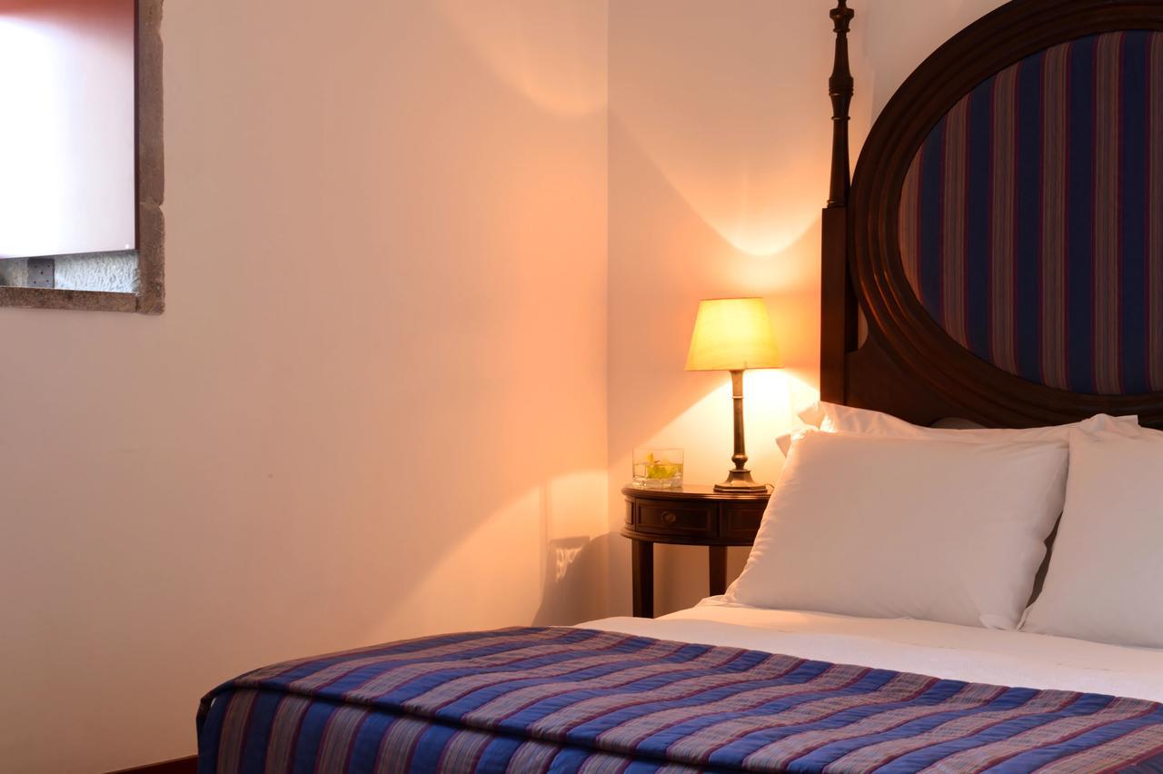 Pousada Mosteiro De Guimaraes Exterior photo A bedroom at the hotel